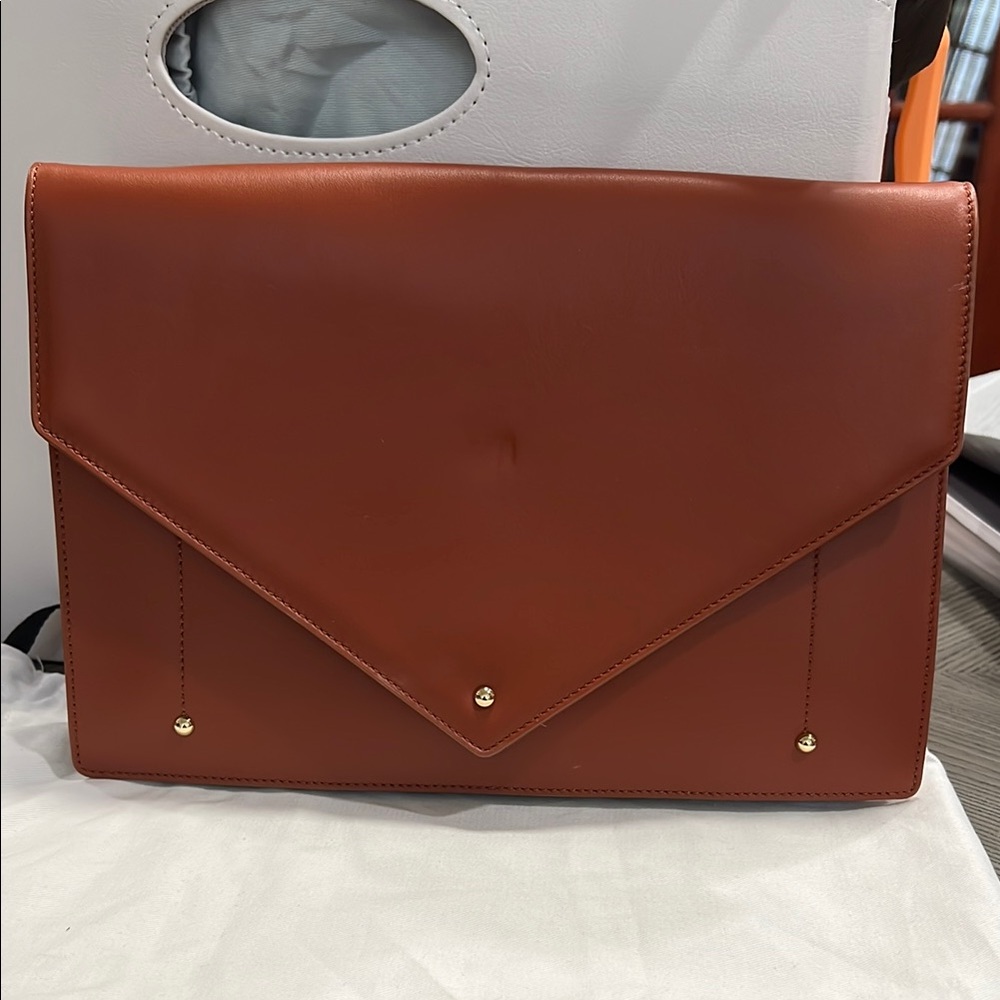 Brown Crossbody Bag with Leather Texture and Flap Closure